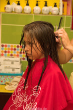 Laden Sie das Bild in den Galerie-Viewer, 8083 Elena cut young girls hair cut in serbian salon in red cape