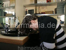 Charger l&#39;image dans la galerie, 351 student Pinar in her salon, forward salon hairwash by barber in black bowl no cape