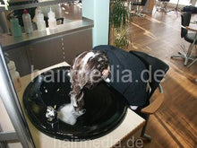 Charger l&#39;image dans la galerie, 351 student Pinar in her salon, forward salon hairwash by barber in black bowl no cape