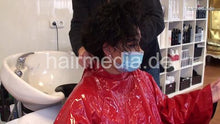 Load image into Gallery viewer, 8162 Barberette Mirsada 1 backward wash by barber in her salon red heavy vinyl cape