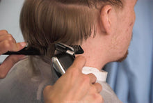 Laden Sie das Bild in den Galerie-Viewer, 239 Benny haircut by Laura large blue cape in barberchair