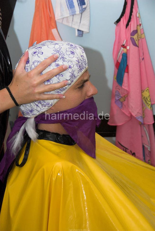 898 3 Sandra forced perm handcuffed in very heavy pvc cape TRAILER