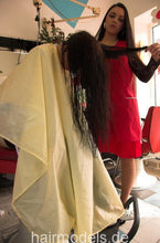Cargar imagen en el visor de la galería, 137 Sarka wash forward shampoo in grey bowl and blow by Luzia in vinyl cape and apron