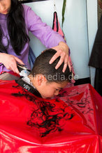 Laden Sie das Bild in den Galerie-Viewer, 240 youngboy by NancyS forced forwardwash and buzz too short in red vinyl cape and RSK apron